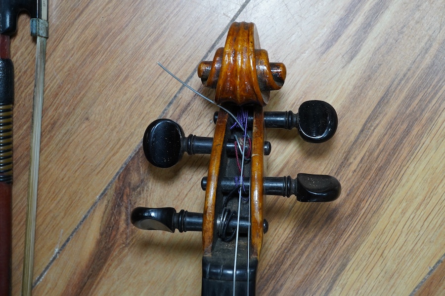 A cased early 20th century European violin, with label reading ‘Antonius Stradivarius Cremonenfis’, body length 36cm, with P&H London bow. Condition - good